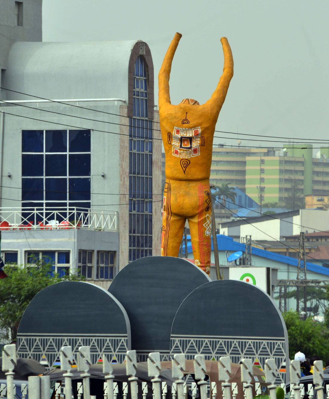 A statue of Fela Kuti with raised fists on Allen Avenue, Lagos