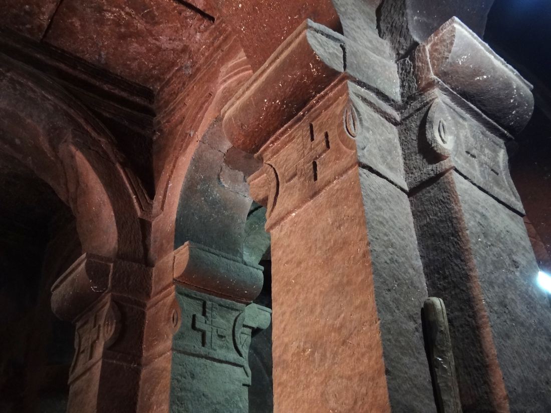 Carved stone columns and arches inside Bet Debre Sina church in Lalibela