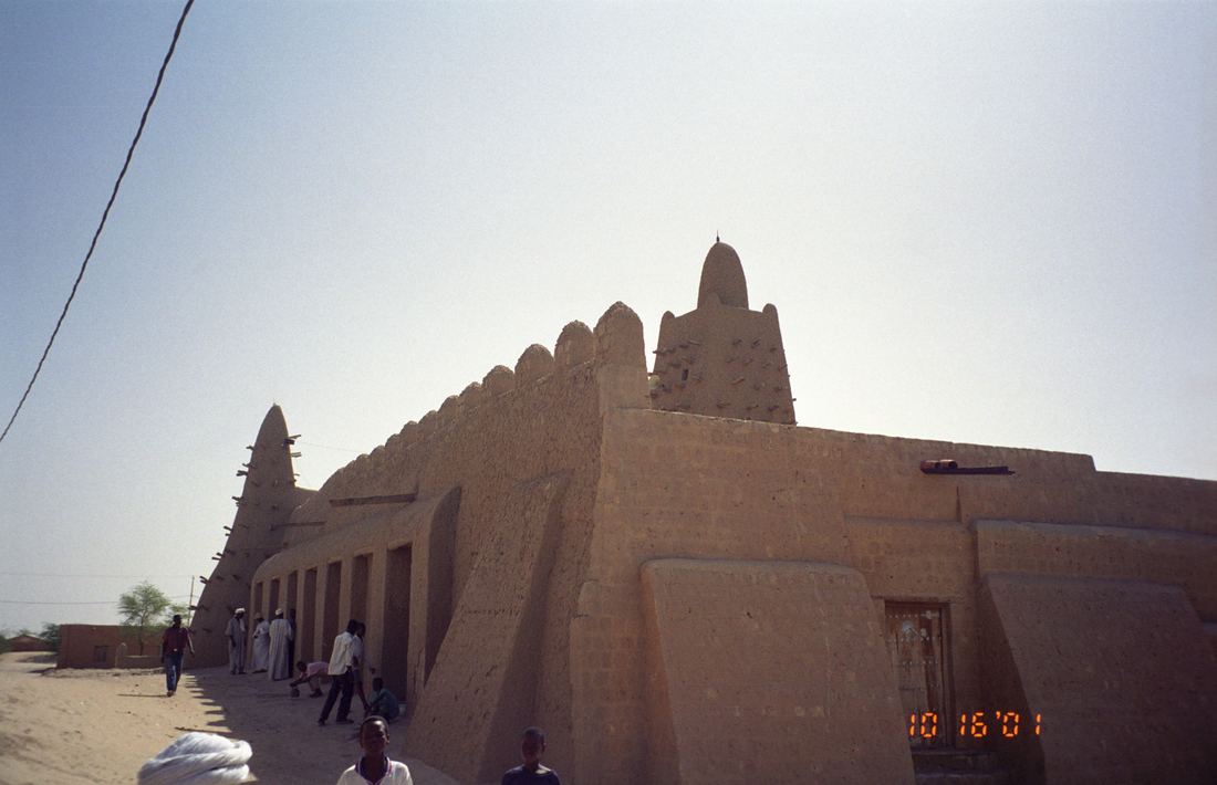 The earthen walls and tower of the Djinguereber Mosque in Timbuktu, Mali